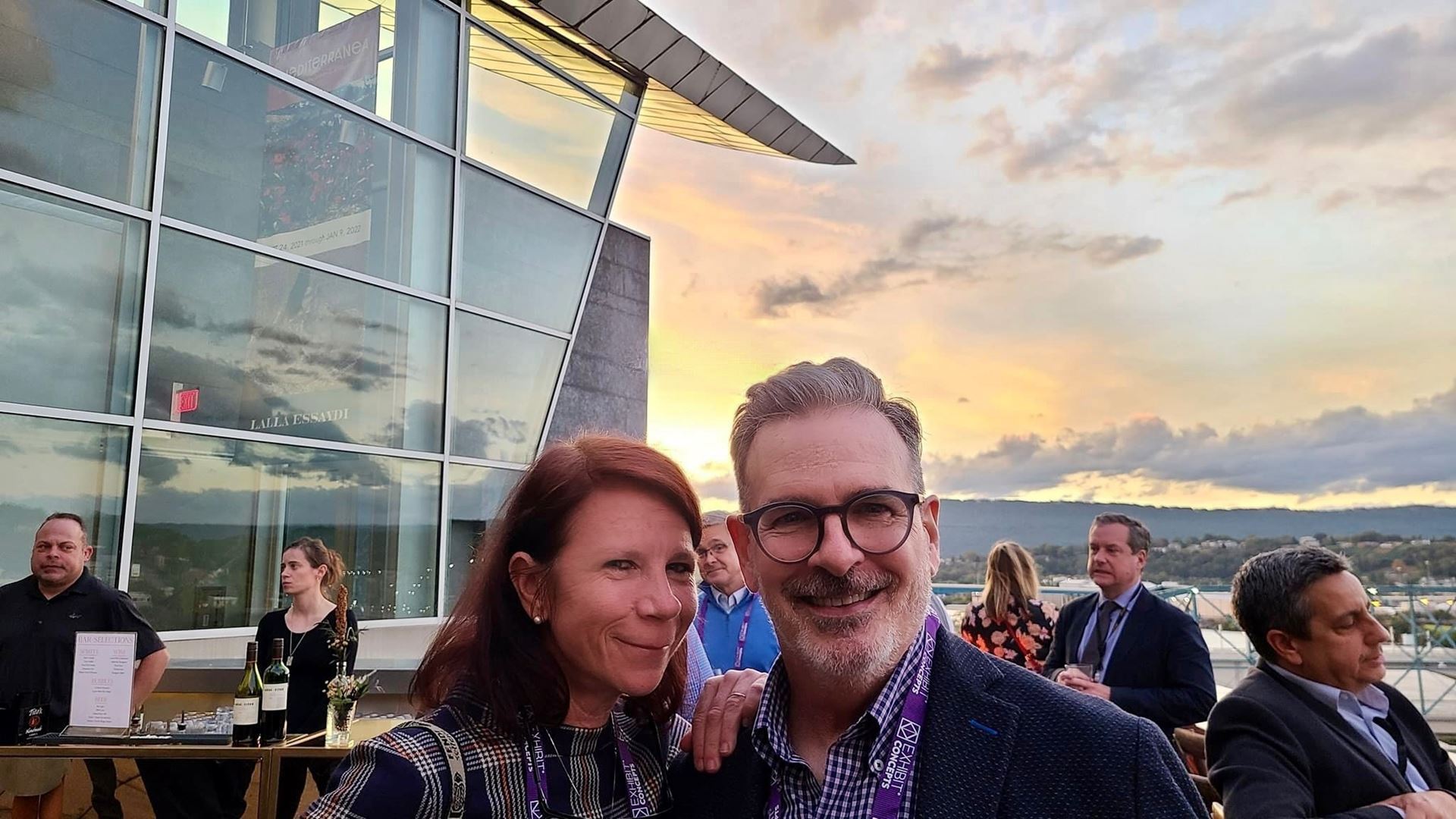 Semc Executive Director, Zinnia Willits and Knoxville Museum of Art Director, David Butler, standing side by side on the rooftop terrace at the Hunter Museum of Art in Chattanooga, TN; mountains and skyline in background.